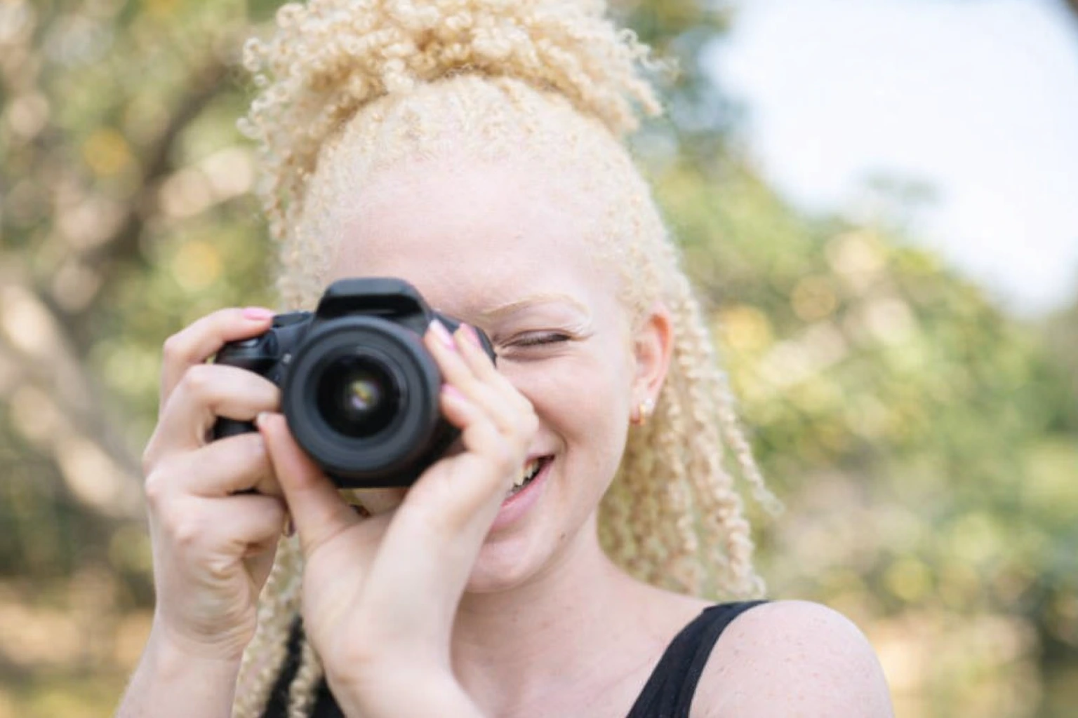 Young female student photographer at work